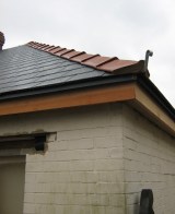 Ridge tiles and cedar trim on.